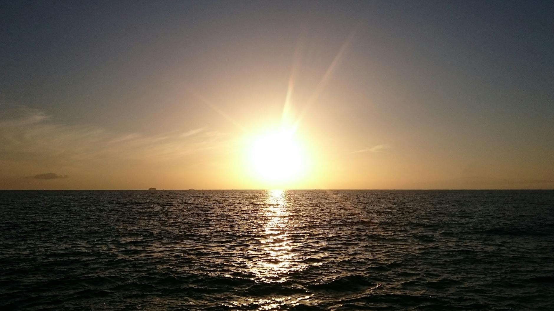 sunrise with body of water